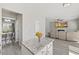 Open-concept living space adjacent to a modern kitchen and a view into the formal dining room at 3101 Riverbrooke Dr, Raleigh, NC 27610