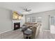 Comfortable living room with fireplace, large sofa, and ceiling fan at 3101 Riverbrooke Dr, Raleigh, NC 27610