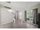 Open-concept space with staircase and large windows for natural light at 3101 Riverbrooke Dr, Raleigh, NC 27610