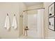 Bright bathroom with a tub-shower combo featuring clean white tiles and simple decor, enhancing a serene ambiance at 320 Madres Ln, Morrisville, NC 27560