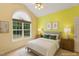 Bright and airy bedroom with a large window, comfortable bed, and warm tones, making for a peaceful sanctuary at 320 Madres Ln, Morrisville, NC 27560