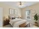 Cozy bedroom with a vaulted ceiling, light walls, and a comfortable bed bathed in soft, natural light at 320 Madres Ln, Morrisville, NC 27560