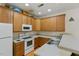 Functional kitchen layout featuring wooden cabinets, and essential appliances for easy cooking at 320 Madres Ln, Morrisville, NC 27560