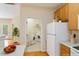 Convenient laundry room with modern appliances, storage shelves, and easy access from the kitchen at 320 Madres Ln, Morrisville, NC 27560