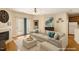 Cozy living room with hardwood floors, fireplace, and doors leading to an outdoor area at 320 Madres Ln, Morrisville, NC 27560