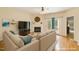 Comfortable living room featuring a fireplace, tv, and access to outdoor space at 320 Madres Ln, Morrisville, NC 27560