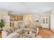 Open-concept living space featuring hardwood floors, neutral walls, and seamlessly connects to the kitchen at 320 Madres Ln, Morrisville, NC 27560