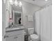 Bathroom featuring granite countertops, white cabinets, and shower with curtain at 3310 Mission Olive Pl, New Hill, NC 27562
