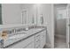 Bathroom with granite countertop, double sinks, and a doorway to the shower room at 3310 Mission Olive Pl, New Hill, NC 27562