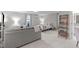 A comfortable bedroom that includes a seating area and bookshelf for storage and decor display at 3310 Mission Olive Pl, New Hill, NC 27562