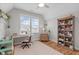 Bright bedroom with a desk, ceiling fan and a bookcase at 3310 Mission Olive Pl, New Hill, NC 27562