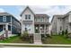 Charming two-story home with a landscaped front yard and inviting green-painted front door at 3310 Mission Olive Pl, New Hill, NC 27562