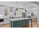 Spacious kitchen with a large island, modern appliances, and white cabinetry at 3310 Mission Olive Pl, New Hill, NC 27562