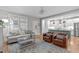 A light-filled living room overlooks a modern kitchen, with lots of seating, and neutral walls at 3310 Mission Olive Pl, New Hill, NC 27562