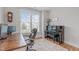 Bright home office with hardwood floors, large window, and elegant piano at 3310 Mission Olive Pl, New Hill, NC 27562