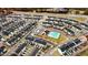 Aerial view of new construction community with a community pool and well-maintained landscaping at 333 Natsam Woods Way, Wake Forest, NC 27587