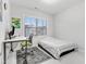 Cozy bedroom with a work space, neutral carpet, and a comfortable bed at 333 Natsam Woods Way, Wake Forest, NC 27587