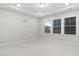 Spacious bedroom featuring plush carpet, recessed lights, and a large window at 333 Natsam Woods Way, Wake Forest, NC 27587