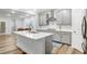 Modern kitchen featuring sleek countertops, stainless steel appliances, and a functional center island at 333 Natsam Woods Way, Wake Forest, NC 27587