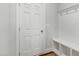 Functional mudroom with coat hooks, bench seating, and wooden floors at 333 Natsam Woods Way, Wake Forest, NC 27587