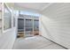 Screened-in patio with concrete flooring, offering a view of the backyard at 333 Natsam Woods Way, Wake Forest, NC 27587