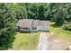 Aerial view of a well-maintained single story home with trees surrounding the property at 3336 Piney Grove Wilbon Rd, Fuquay Varina, NC 27526