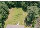 Expansive backyard offers privacy and outdoor space for recreation and relaxation with a small wooden deck attached to the house at 3336 Piney Grove Wilbon Rd, Fuquay Varina, NC 27526