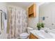 A well-lit bathroom with oak cabinets, a toilet, and a shower and tub combo at 3336 Piney Grove Wilbon Rd, Fuquay Varina, NC 27526