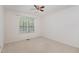 Bedroom has a ceiling fan and a large window that brings in natural light at 3336 Piney Grove Wilbon Rd, Fuquay Varina, NC 27526