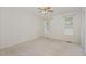 Spacious bedroom with neutral carpet, two windows, and a ceiling fan at 3336 Piney Grove Wilbon Rd, Fuquay Varina, NC 27526
