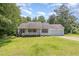 Charming single-story home with a well-manicured lawn and attached garage at 3336 Piney Grove Wilbon Rd, Fuquay Varina, NC 27526