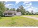 Well-maintained home with large yard, driveway, and view of nearby pond at 3336 Piney Grove Wilbon Rd, Fuquay Varina, NC 27526