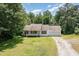 Charming single-story home with covered porch, garage, and well-maintained lawn at 3336 Piney Grove Wilbon Rd, Fuquay Varina, NC 27526