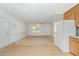 View of a living room open to the kitchen, showcasing the floorplan at 3336 Piney Grove Wilbon Rd, Fuquay Varina, NC 27526