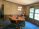 Dining room with an octagonal table, comfortable chairs, and natural light at 3555 Nc 98 Hwy, Youngsville, NC 27596