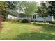Charming single-story home with a well-maintained front yard and mature trees at 3555 Nc 98 Hwy, Youngsville, NC 27596
