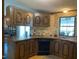 Traditional kitchen with wooden cabinets and ample counter space for meal preparation at 3555 Nc 98 Hwy, Youngsville, NC 27596