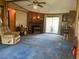 Cozy living room with a fireplace, comfortable seating, and built-in shelving at 3555 Nc 98 Hwy, Youngsville, NC 27596