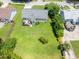 Aerial view of a home with a spacious backyard and deck, surrounded by lush greenery and mature trees at 3624 Meadow Creek Ln, Raleigh, NC 27616