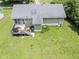 Backyard aerial view of a home with a deck and an expansive lawn at 3624 Meadow Creek Ln, Raleigh, NC 27616