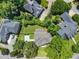 Aerial shot of the house with lush landscaping and large driveway at 3811 Cottonwood Dr, Durham, NC 27705