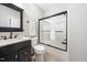 Bathroom with marble vanity and shower with glass door at 3811 Cottonwood Dr, Durham, NC 27705