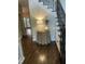 Foyer with hardwood floors, staircase, decorative table and wainscotting at 3811 Cottonwood Dr, Durham, NC 27705