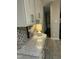 Bright kitchen featuring granite countertops, mosaic tile backsplash, and stylish cabinets with gold hardware at 3811 Cottonwood Dr, Durham, NC 27705