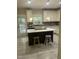 Bright kitchen featuring an island, pendant lighting, and white cabinets at 3811 Cottonwood Dr, Durham, NC 27705
