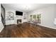 Cozy living room with fireplace, built-in shelving, and hardwood flooring at 3811 Cottonwood Dr, Durham, NC 27705