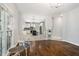 Inviting living space with hardwood flooring, leading to a kitchen and dining area at 3811 Cottonwood Dr, Durham, NC 27705