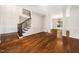 Open-concept living space featuring hardwood floors, wainscoting, and abundant natural light at 3811 Cottonwood Dr, Durham, NC 27705