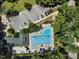 Aerial view of a pristine swimming pool with ample parking, landscaping, and various amenities at 3811 Cottonwood Dr, Durham, NC 27705