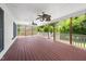 Large porch with ceiling fans and string lights for outdoor entertaining at 3811 Cottonwood Dr, Durham, NC 27705